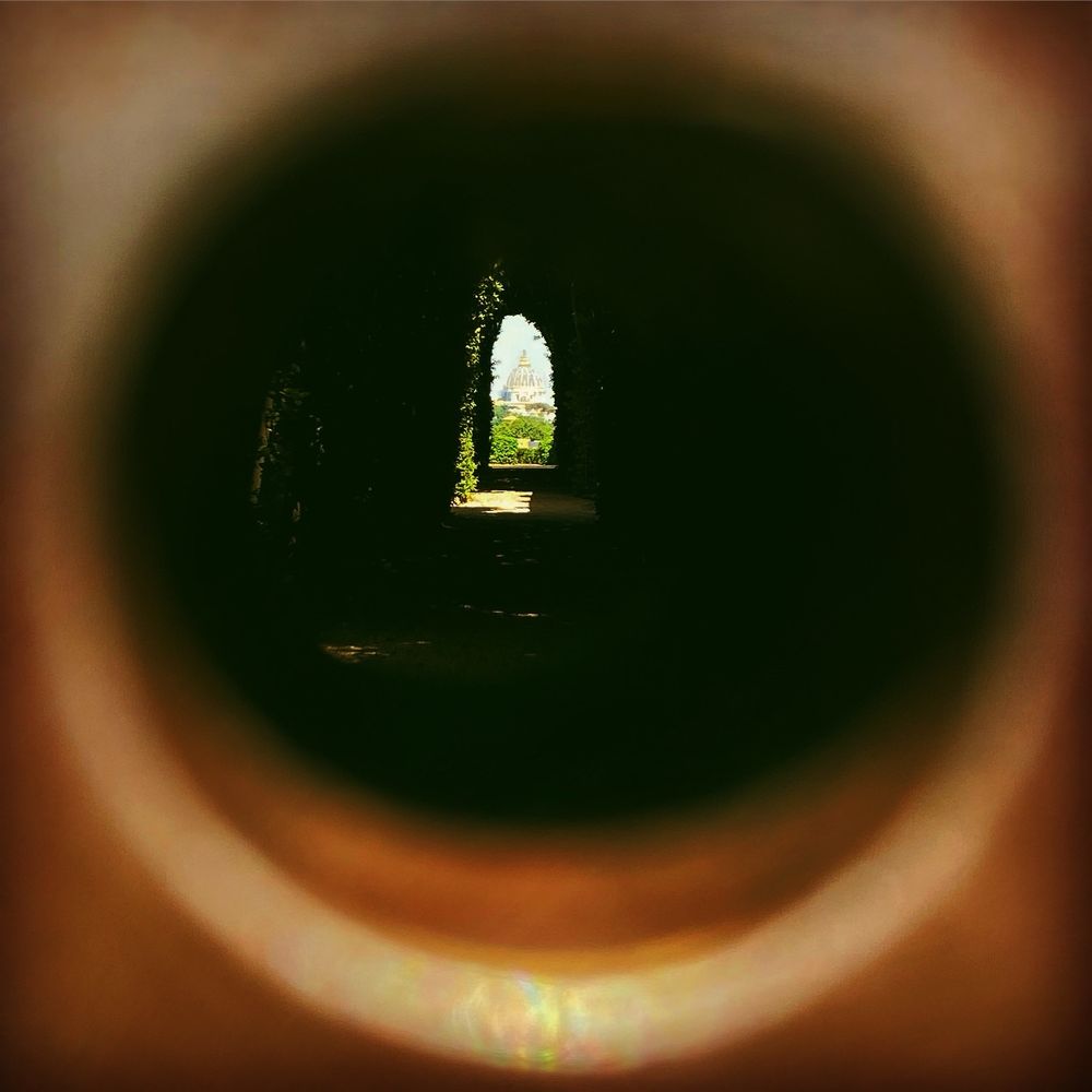 View of the dome of St Peter’s Basilica through keyhole of the gate of the priory of the knights of Malta