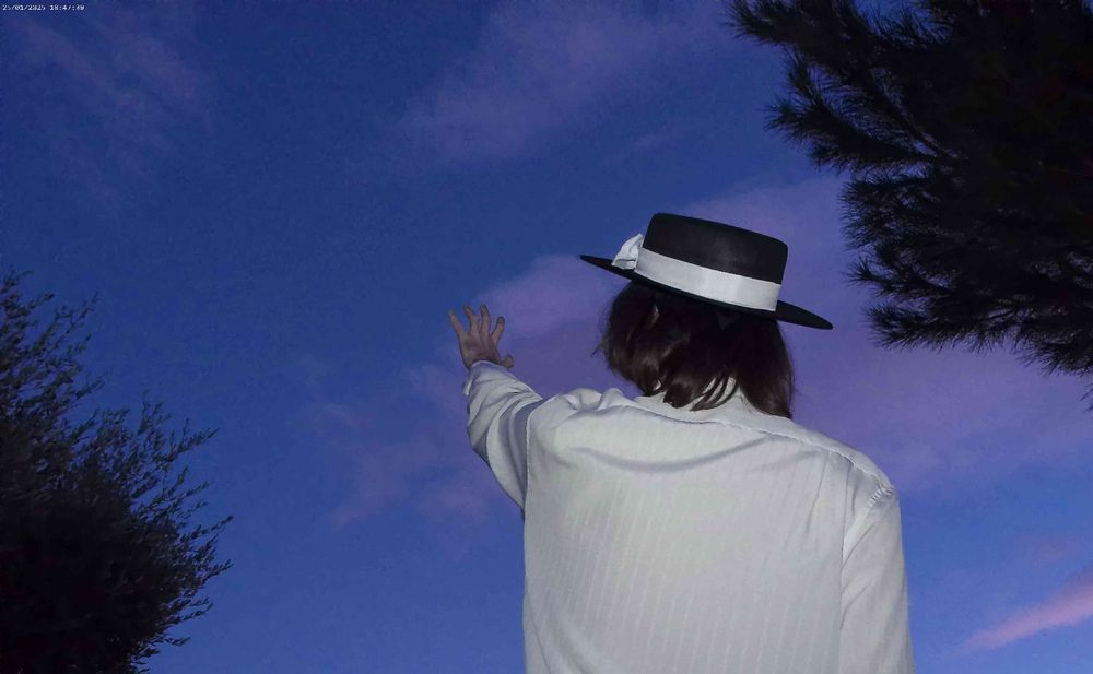 Renko Usami from Touhou Porject cosplay, with her hand stretched towards the sky