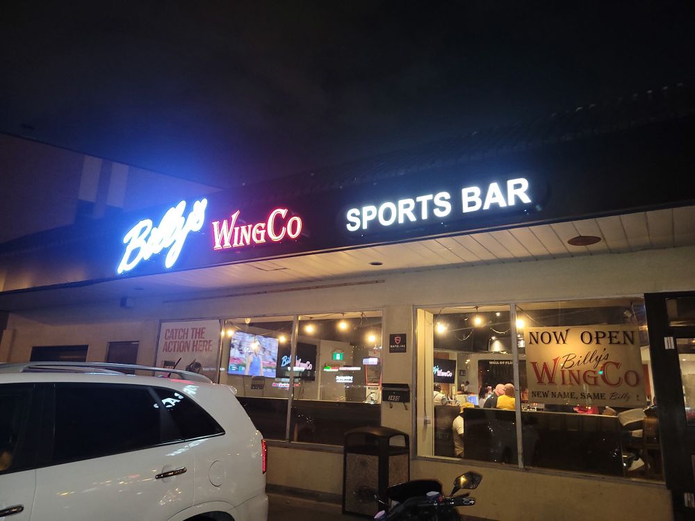 Night time picture of new sign for Billy’s WingCo sports bar in Scarborough Ontario. 