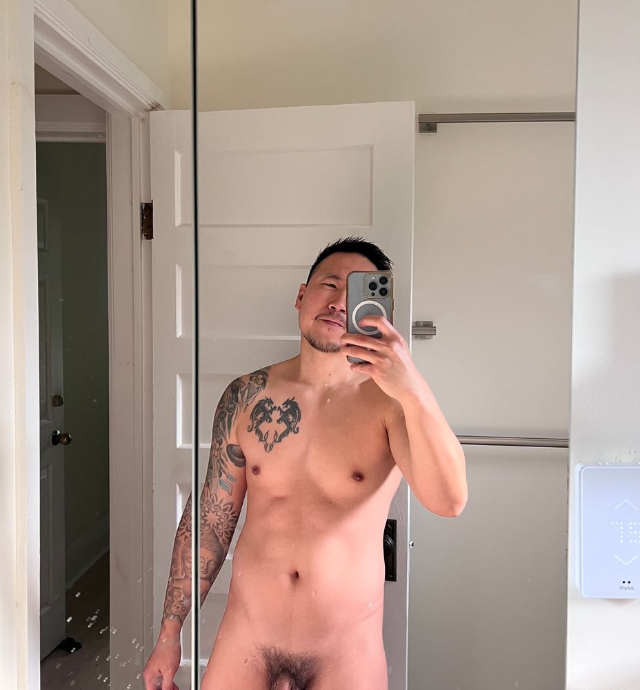 Naked mirror selfie of man showing base of penis