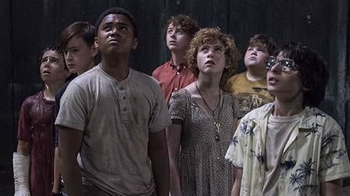 The Losers club stare up at something out of shot, except for bill who looks forward. From the film 'It' (2017)