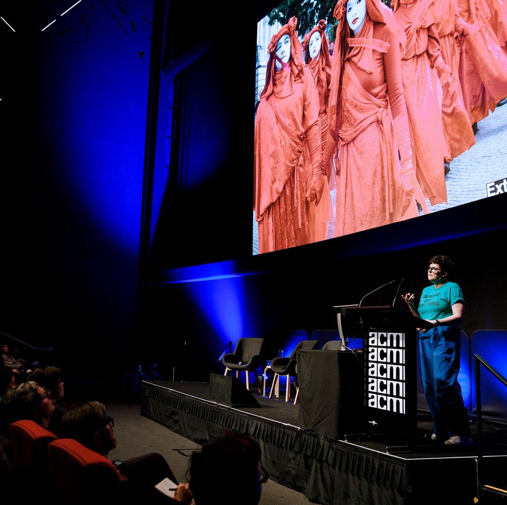 FACT symposium at ACMI, view from audience to speakers on the stage. 