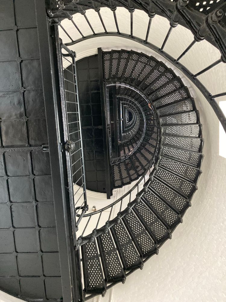 Inside the Bodie Island Light Station, looking up at the spiral staircase.
