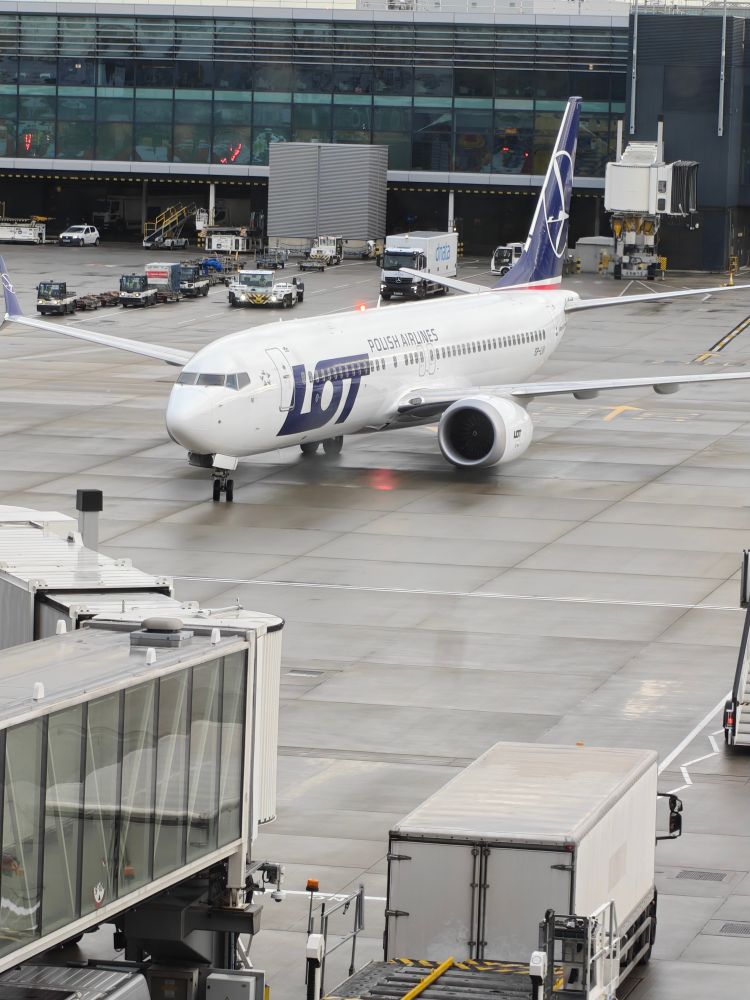 A LOT airlines Boeing 737 Max aircraft approaching the gate at Heathrow. Not actually a train. 