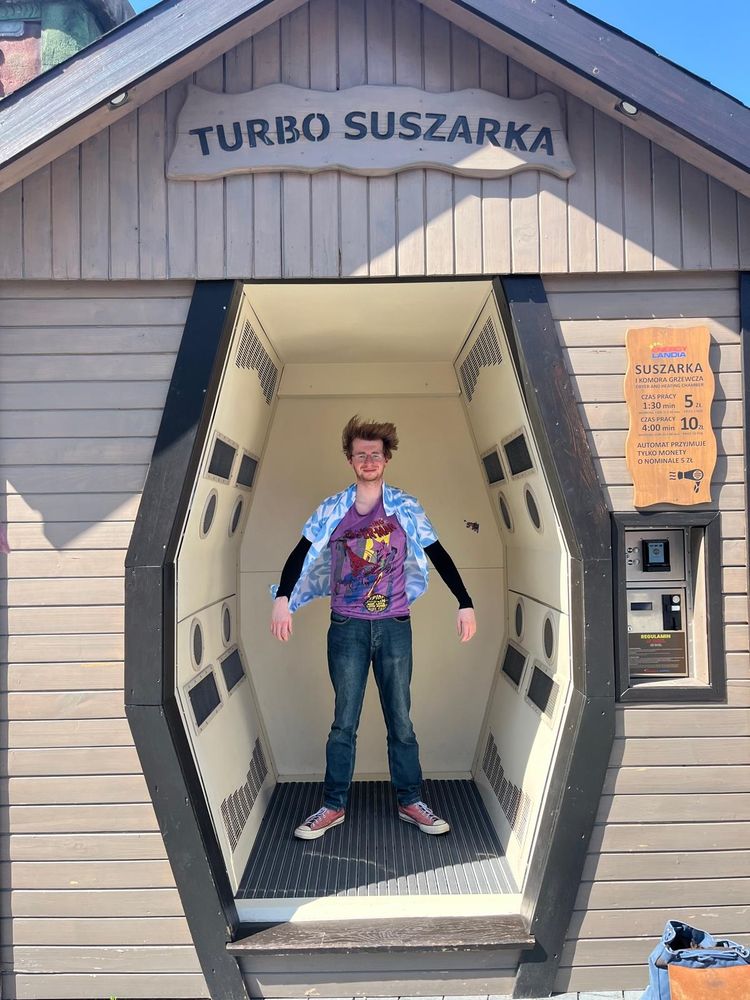Keenan being turbo dried in a big dryer after going on a water rollercoaster.
