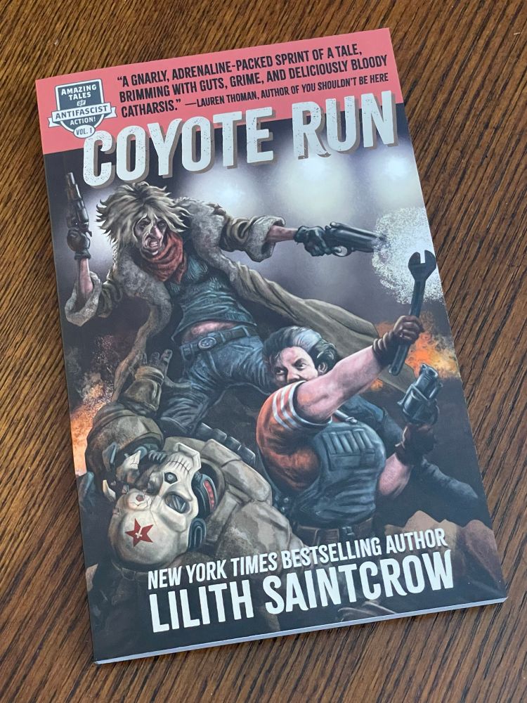 A copy of Coyote Run by Lilith Saintcrow with cover art by Phineas X Jones. Features two women kicking fascist ass 