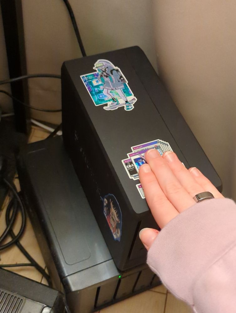 me petting a synology DS723+ that is standing on top of a DX517, with lots of wires behind them

a small chunk of a APC UPS is visible in the corner
