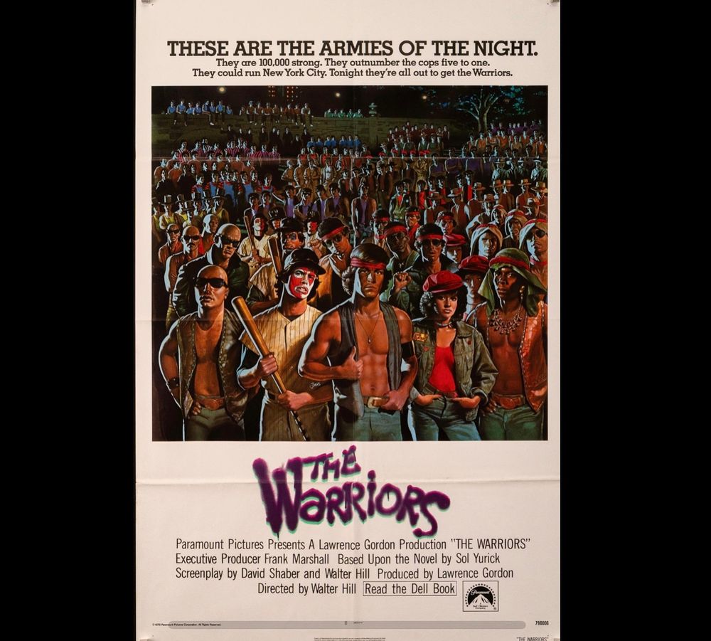 Movie poster for The Warriors (1979). Image of massed gang members. Tagline: These are the armies of the night. 