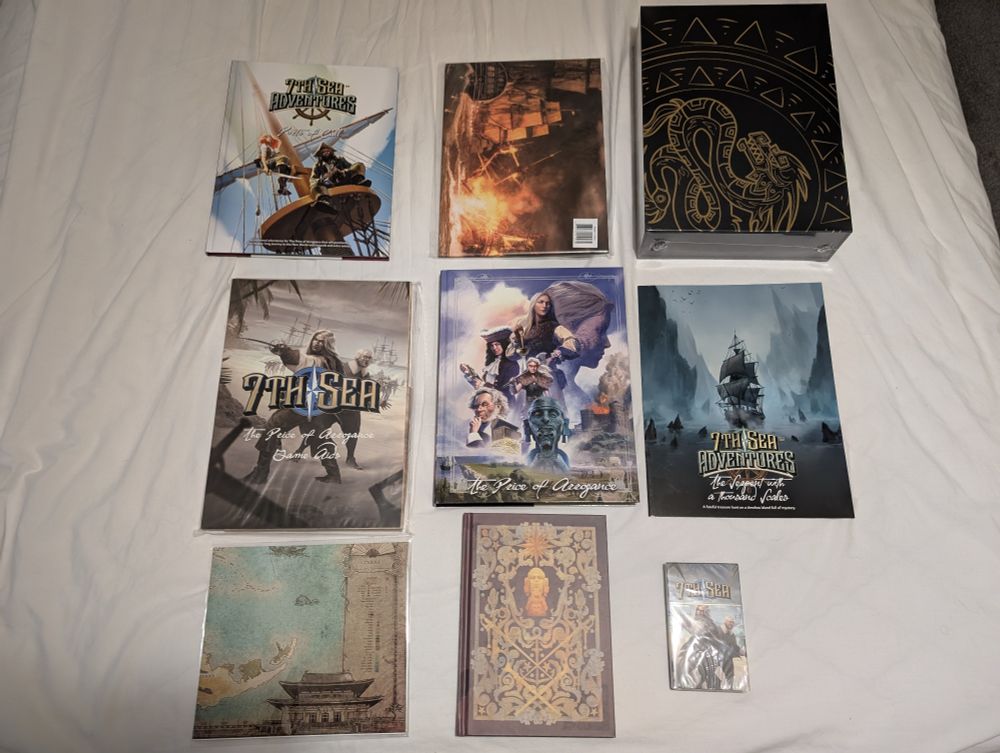 3 books, a slipcase, a deck of cards, GMs screen, Map and Notebook