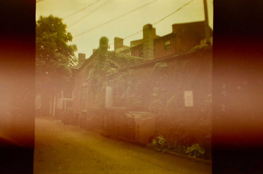 Old fujifilm photo taken by a Diana mini of a downtown New England setting 