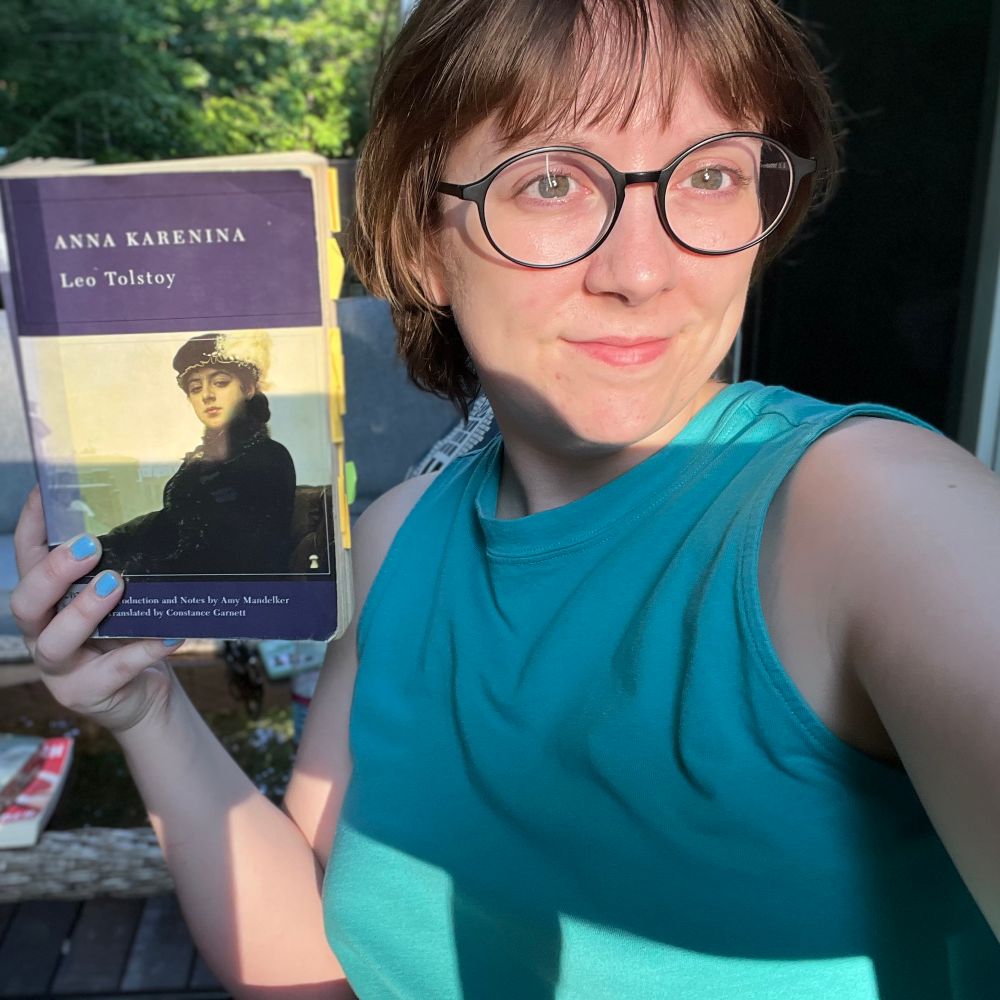 Photo of a woman holding a Barnes & Noble classics edition of Anna Karenina by Leo Tolstoy 
