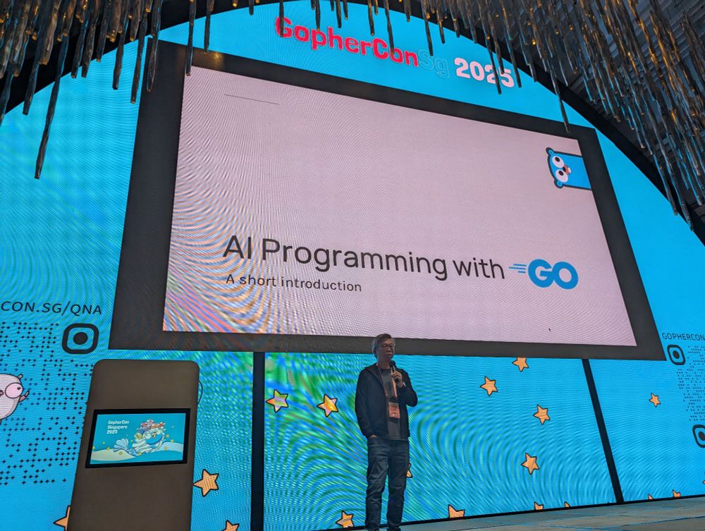 Chang Sau Sheong on stage at #gopherconSG giving a talk on AI programming with Go
