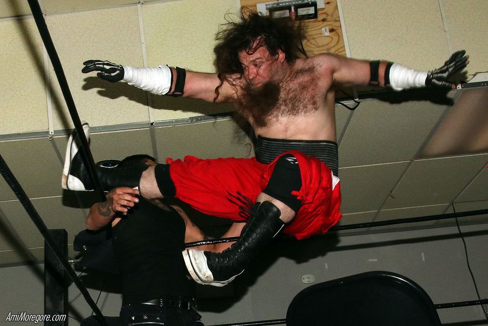 Alex Stretch with a boot to the face of Mouse
