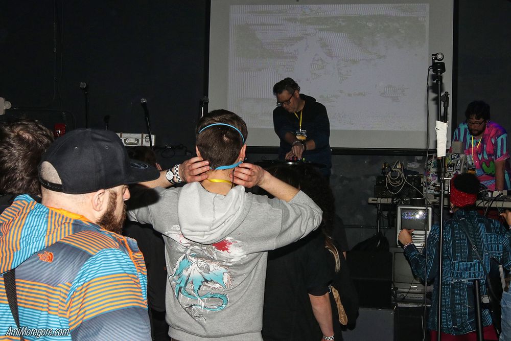 Trash80 playing on stage in front of a crowd