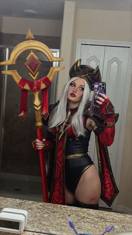 Selfie in the bathroom mirror of dark lady dressed as Whitemane 