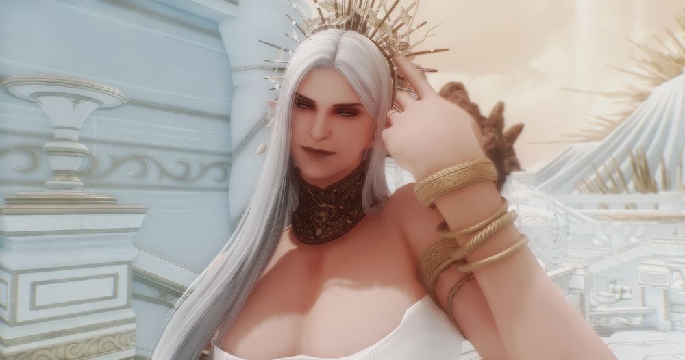 Close-up of Arisoix. He has on a golden gorget, various golden bracelets, and a golden sun-like headpiece that juts out like rays of the sun behind his head. He looks off to the left with a smirk