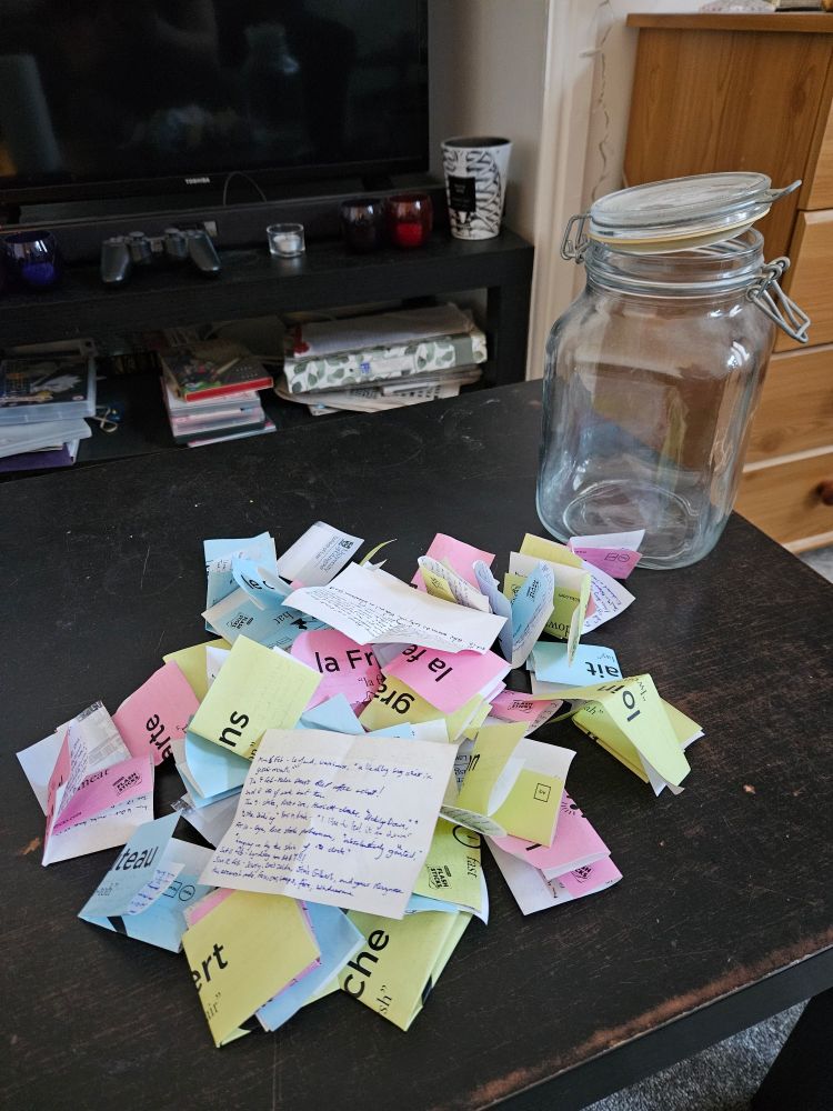 The jar is emptied, and on a black coffee table, various post it notes are closed, open, like colourful butterflies