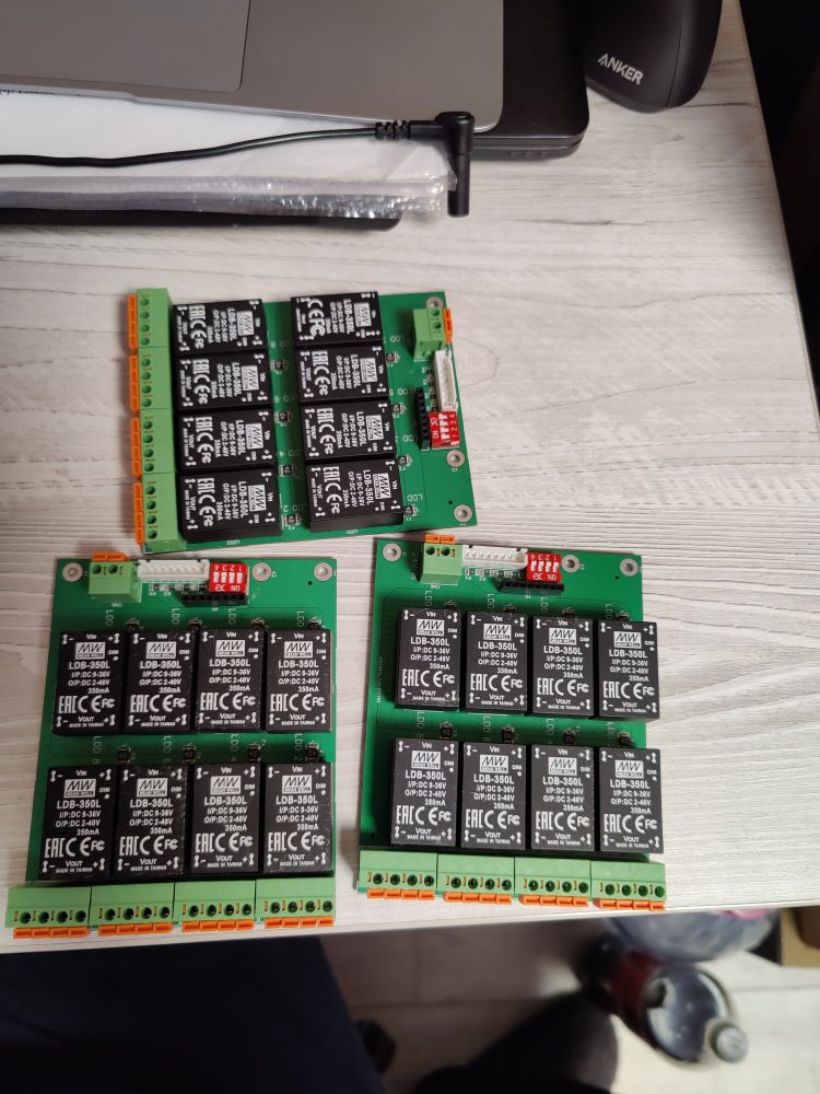 Image of 3 custom PCBs populated with LED drivers
