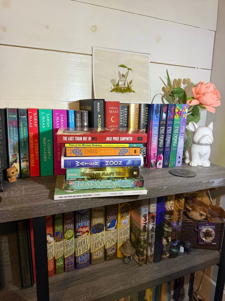 Lore Olympus
REBECCA YARROS
CRESCENT CITY
JULIE PRICE CARPENTER
LEGENDS & LATTES 
SARAH J. MAAS
WATER MOON
THE LAST TRAIN OUT OF HELL
Days at the Morisaki Bookshop
EMMA JANE AUSTEN
TJ KLUNE
A COURT of MIST AND FURY
A COURT of THORNS AND ROSES
UNDER THE WHISPERING DOOR
THE HOUSE IN THE CERULEAN SEA
HOUSE OF MANY WAYS
HONEY WITCH
FROG AND TOAD ARE DOING THEIR BEST A PARODY
LABYRINTH
TOTORO