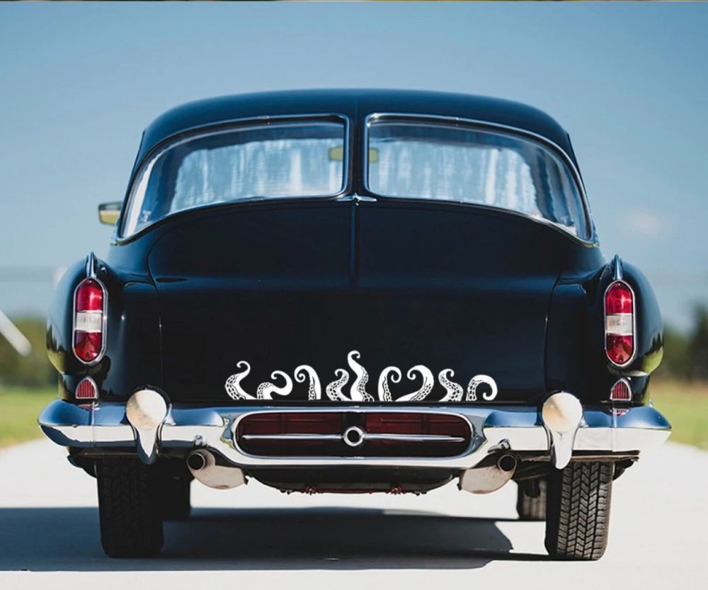 Black vintage car with white tentacles decals