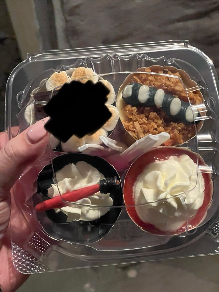 Photo of four mini cheesecakes inside a plastic container