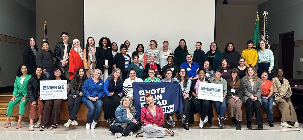 Group photo of participants of the "Run As You Are 2025" group with signs saying "Vote Run Lead Action" and "Emerge Washington".