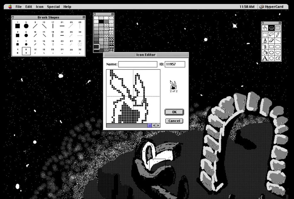 A picture of the hypercard interface. The window in the center of a screen shows someone drawing an icon. Behind this window is the hypercard interface - someone is working on an outdoor scene with a stone arch below a starry sky. There are a few other windows open - a brush selection window and a tool selection window.