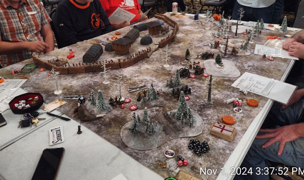 Besieging forces outside a log-palisade fort, on snow-covered terrain