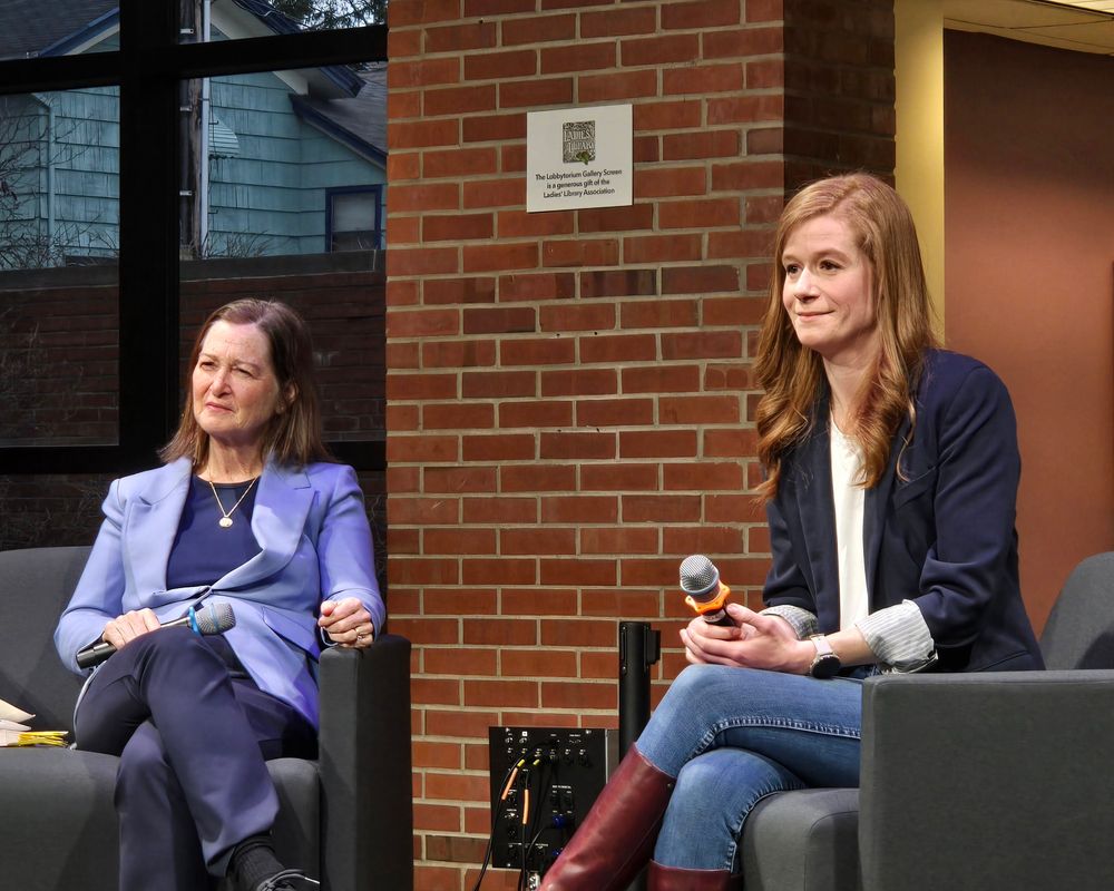 Two women seated, holding microphones. Barb McQuade on the L and Mallory McMorrow on the R.