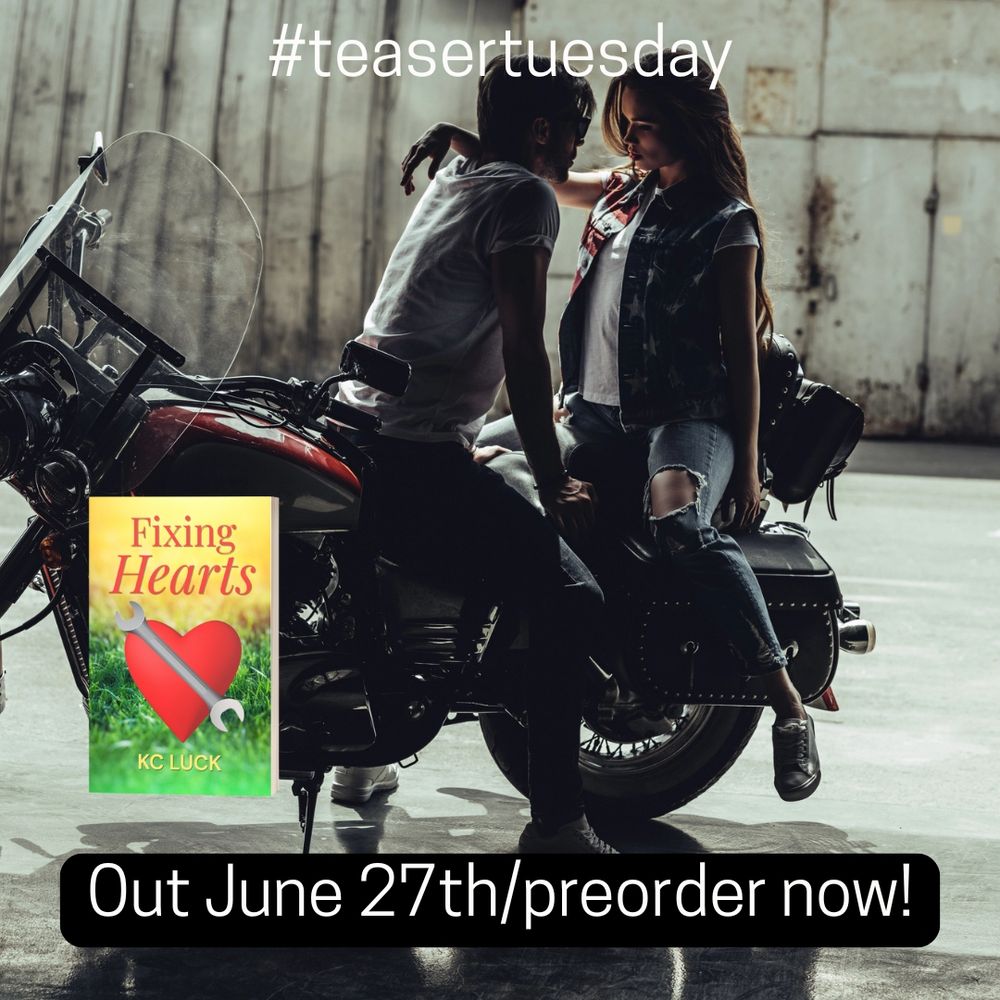 Butch woman face to face with a femme woman on the back of a motorcycle