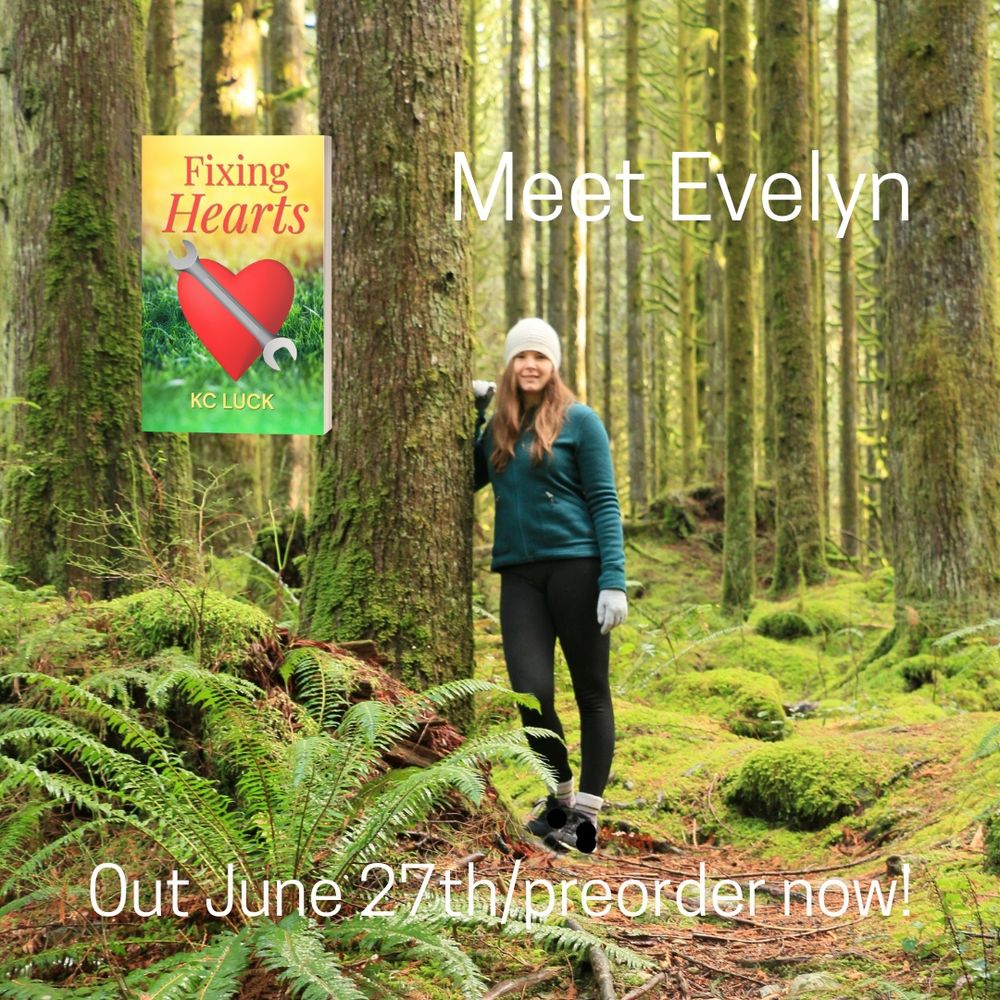 Woman standing in a forest of trees and ferns.