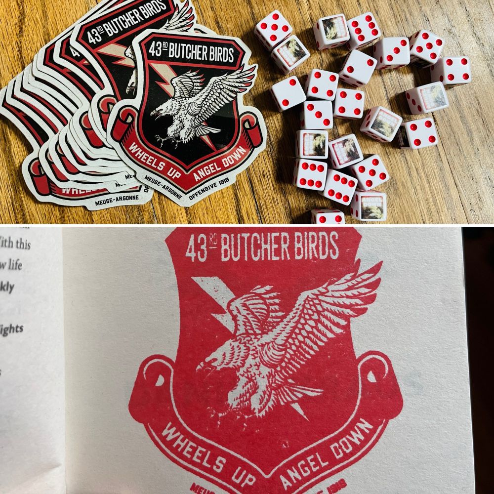 An image that shows angel down stickers, dice, and stamp
