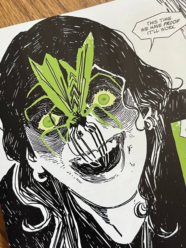 A close-up of a demented girl with a insect on her face