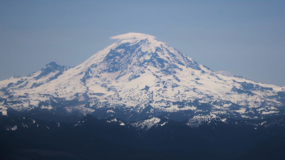 Mt Rainier from a flight with a lenticular cloud on top
