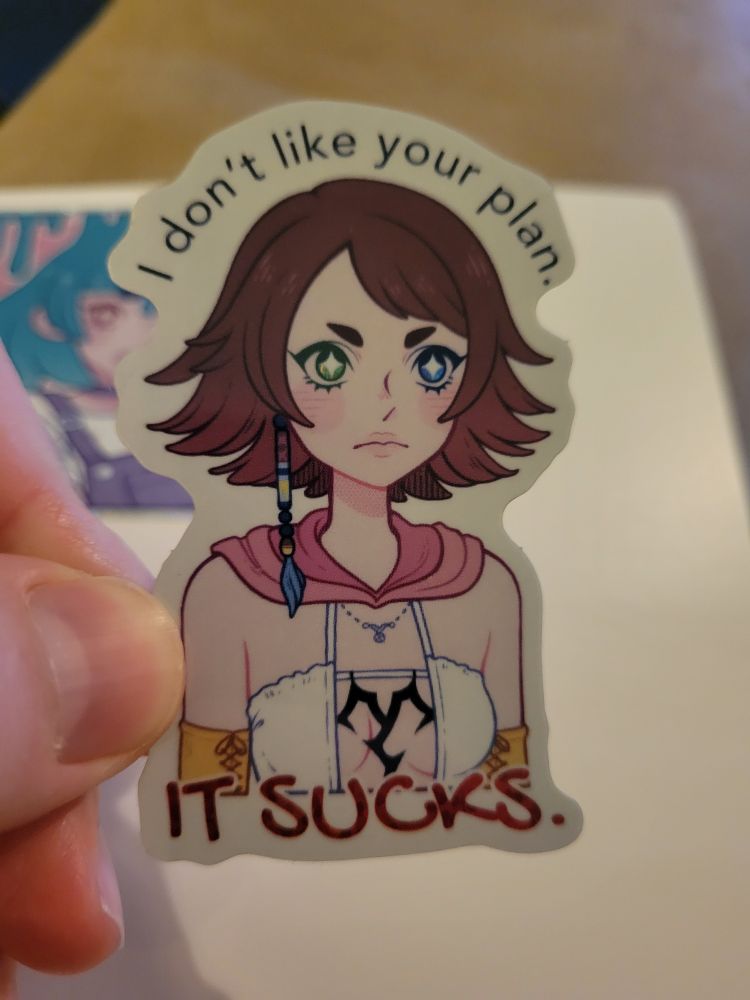A sticker of Yuna from FFX-2 saying, "I don't like your plan. It sucks."