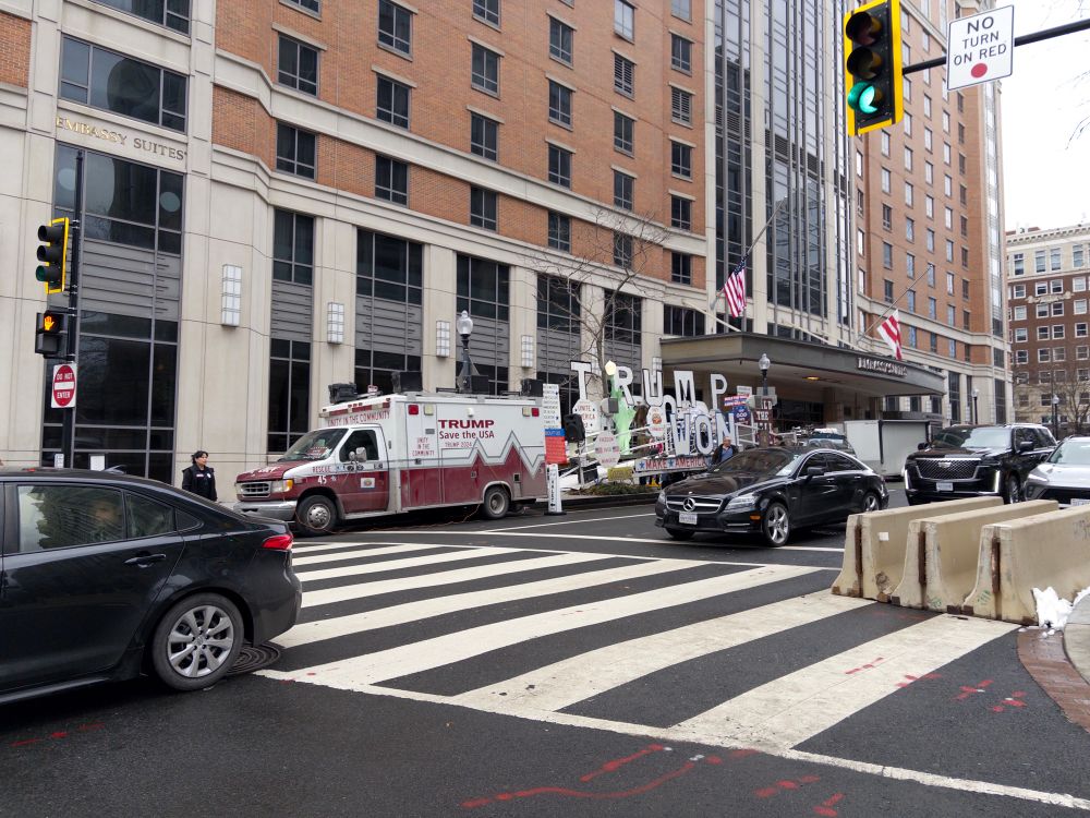 huge installation with pro-trump signs parked on the street of dc