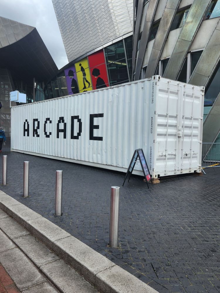 A shipping container with the word Arcade on it.