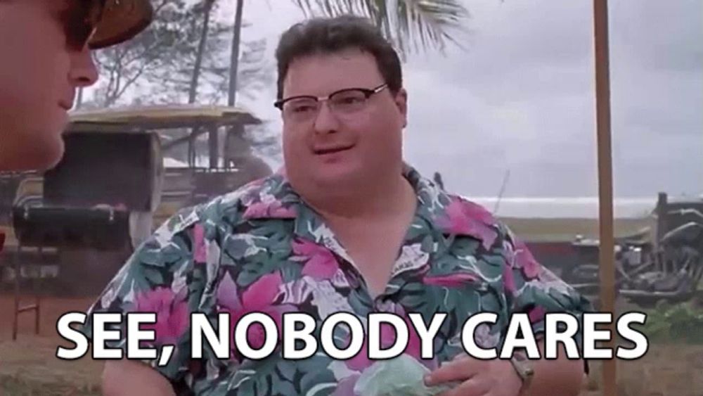 a man wearing glasses and a hawaiian shirt says `` see , nobody cares ''