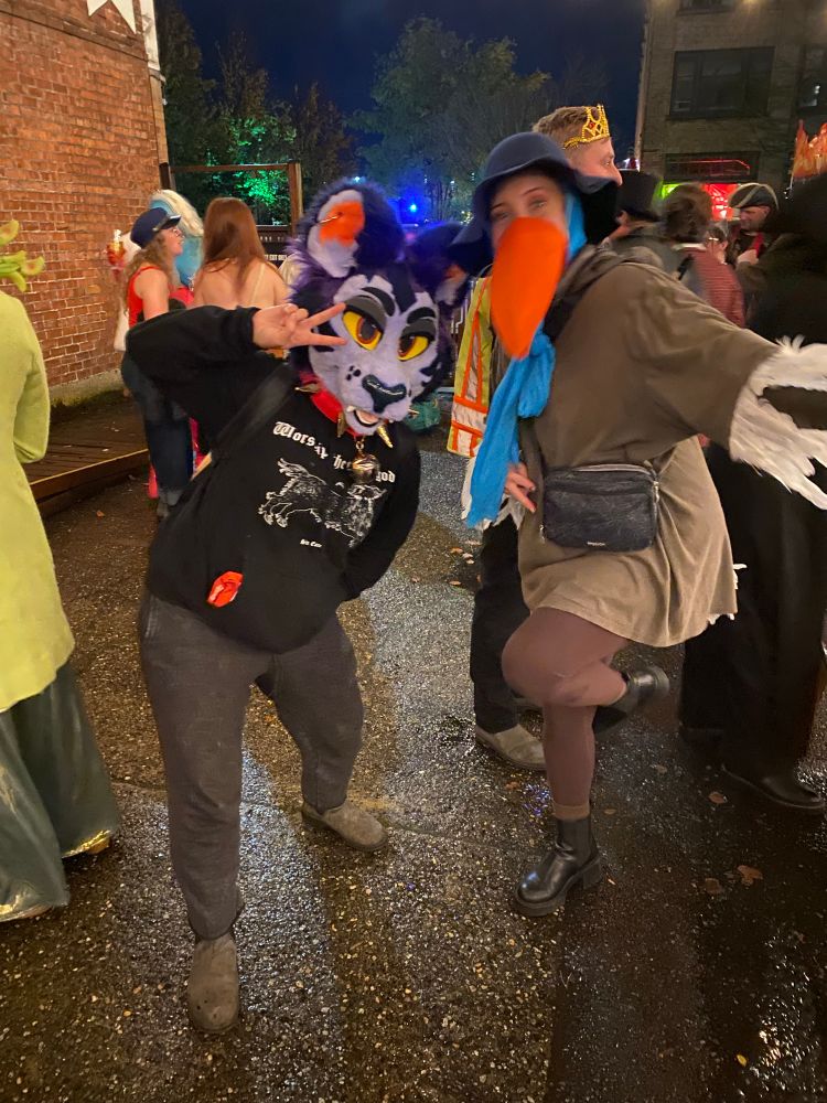 poster poses with person dressed as disney’s robin hood disguised as a stork