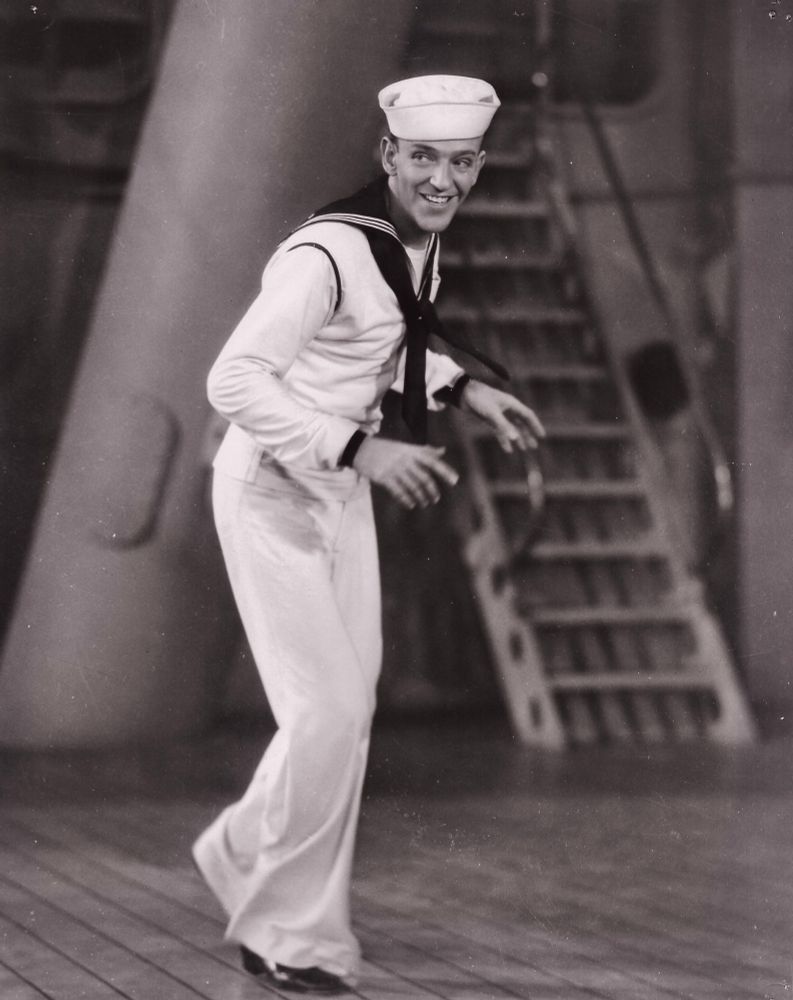 Astaire in sailor’s outfit on a ship’s wooden deck