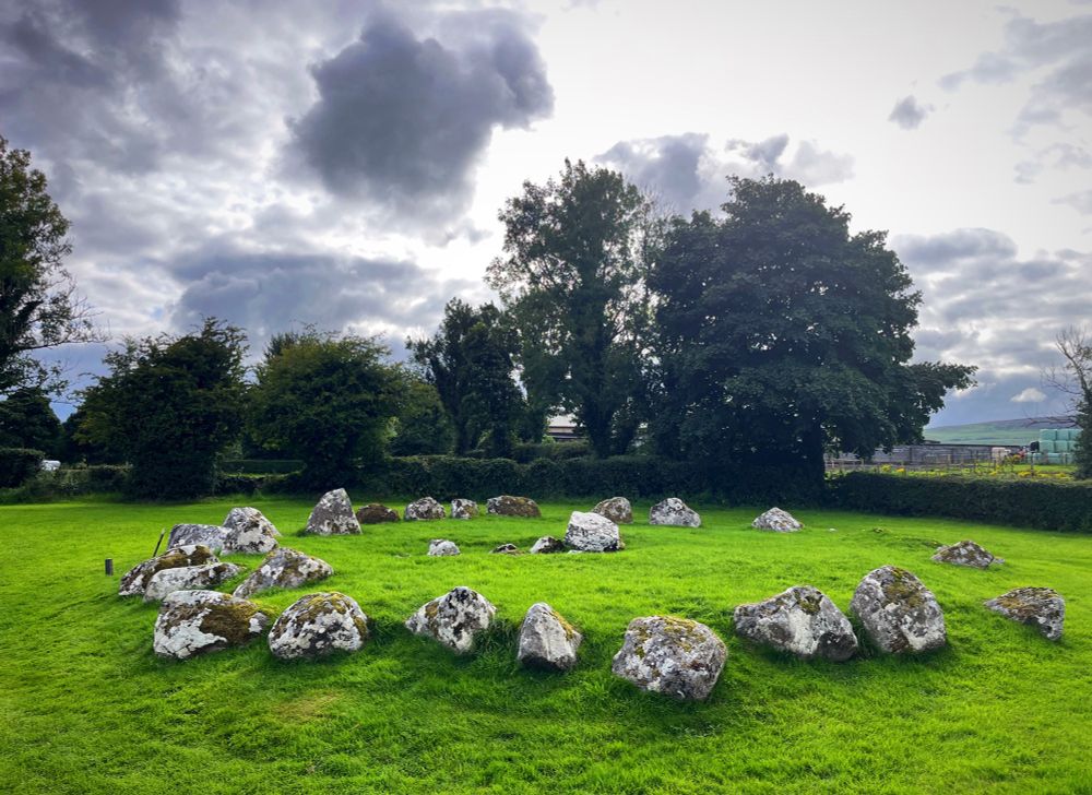 A photo of a ring of stones - all that remains of a passage tomb.