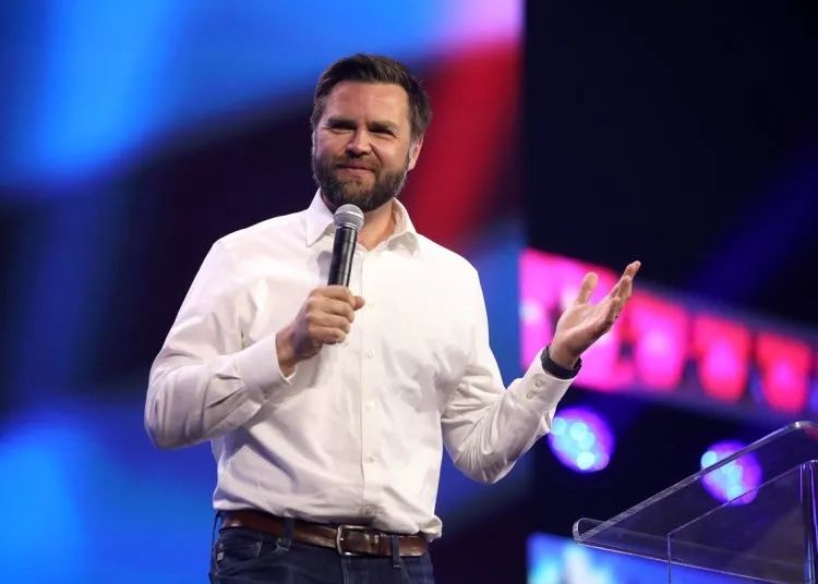 JD Vance with a microphone 