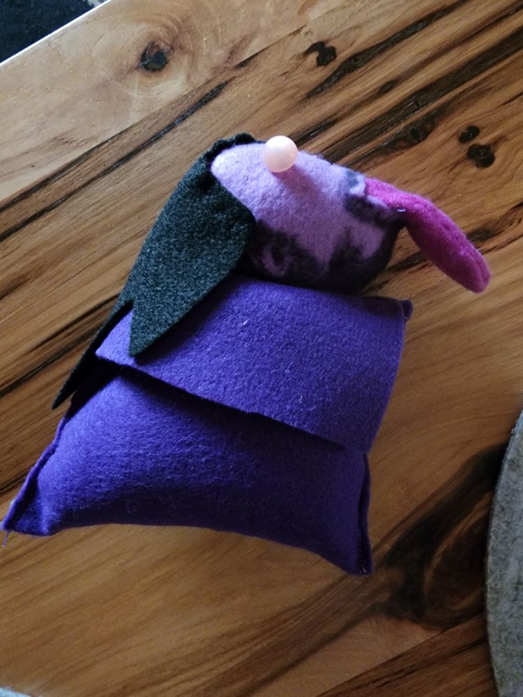 The Christmas present my roommate sewed me of Spite, shoulders up only, bulgy button eyes, extremely long tongue hanging out of his mouth.

Please note that a few weeks later when she saw it on my shelves of Dragon Age stuff she asked me what it was--even though she's the one who sewed it.