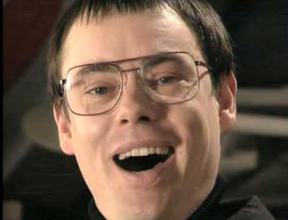 Image of the actor Kevin Eldon as Simon Quinlank "the King of all Hobbies". From BBC2 comedy television Fist of Fun written by and starring Richard Herring and Stewart Lee.