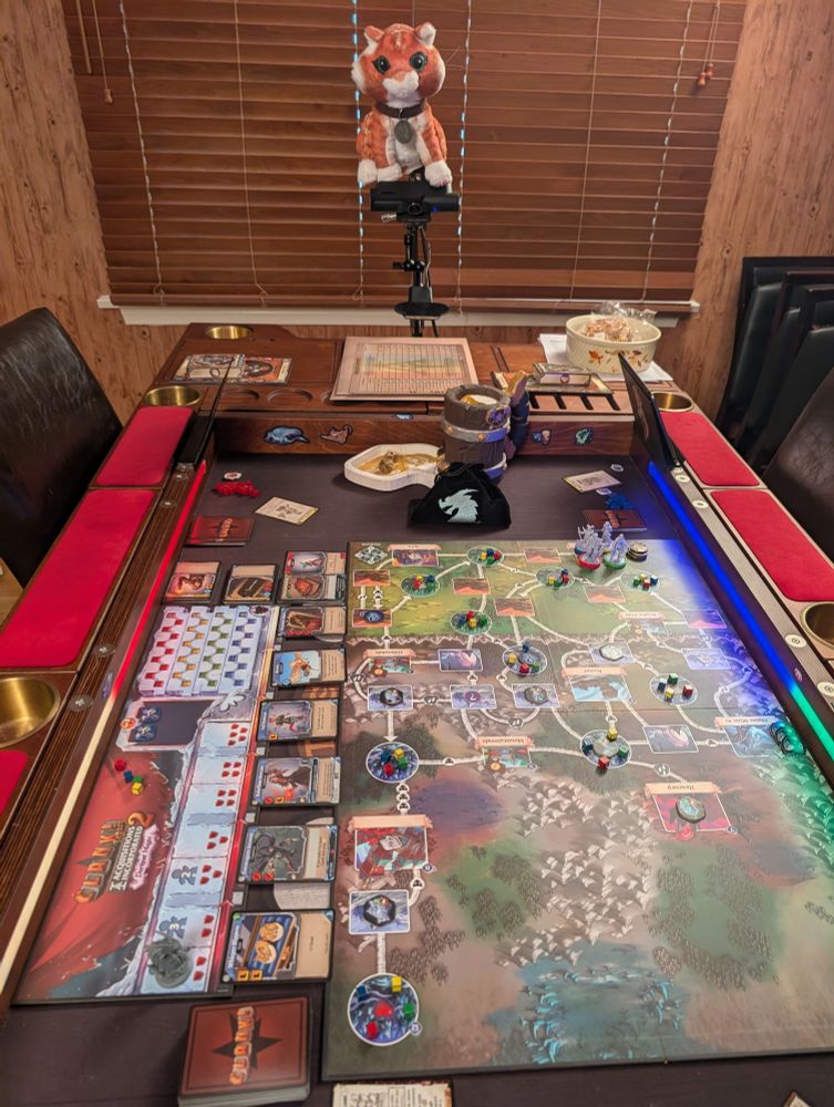 Mr Whiskers looks over a fresh copy of Clank! Legacy 2