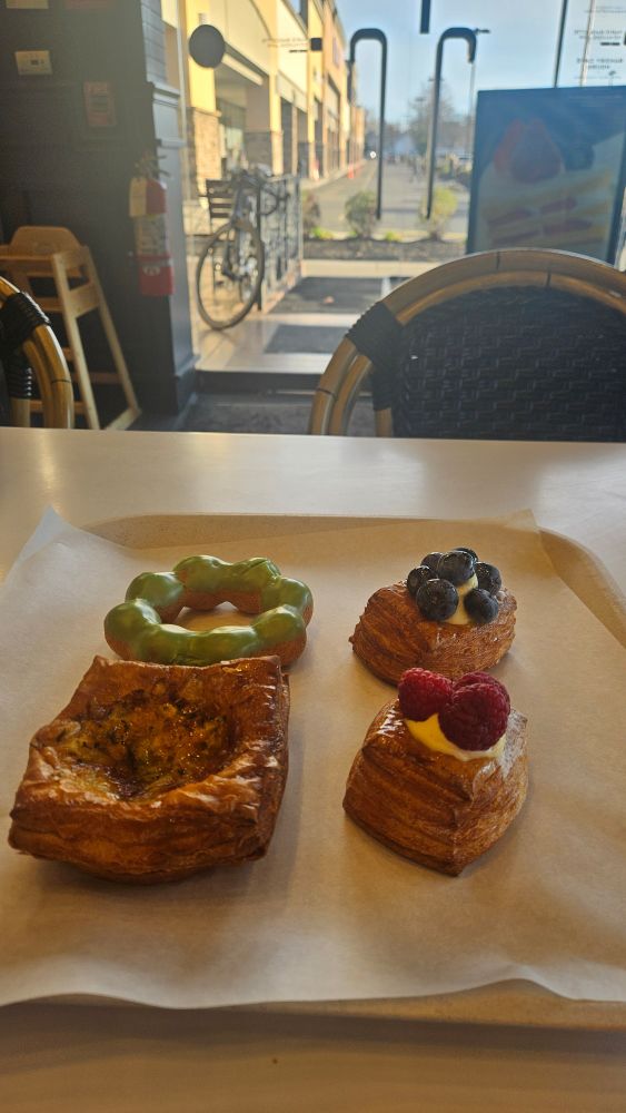 Four pastries on a tray