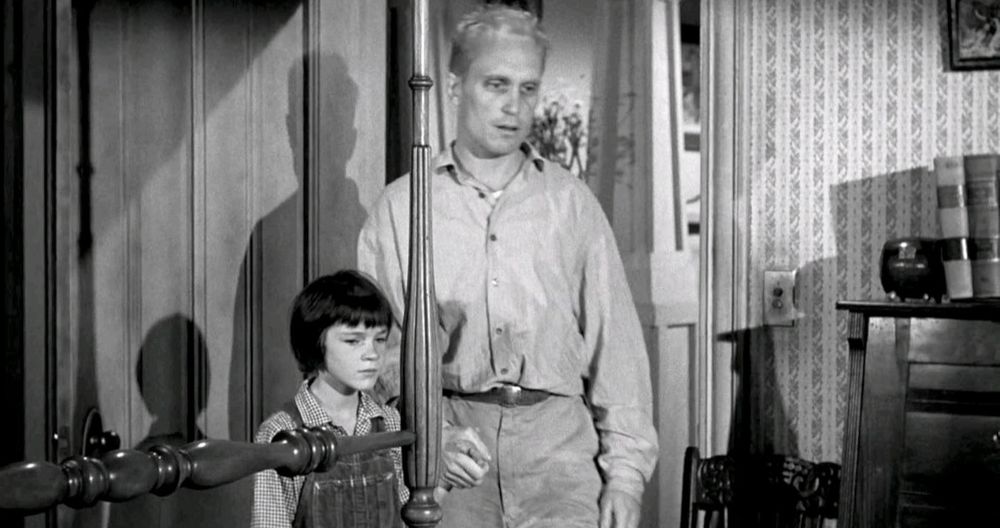 To Kill a Mockingbird: In bedroom, Duvall holds hands with young girl (Mary Badham).