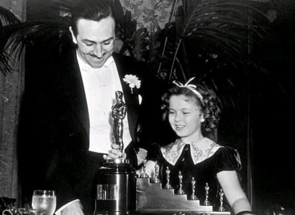 Walt Disney with Shirley Temple.