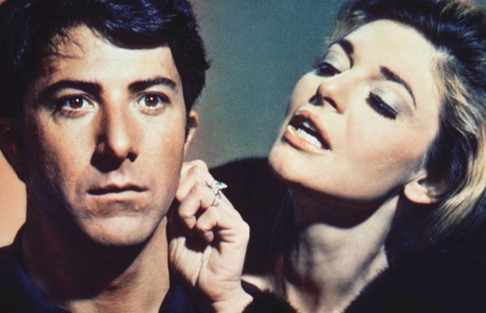 The Graduate: Dustin Hoffman staring blankly as Anne Bancroft fondled his neck.
