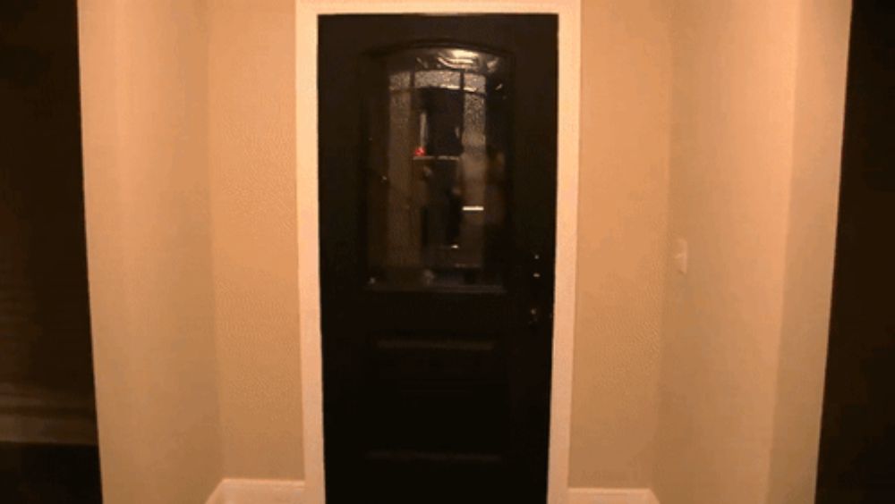 a black door with a clear glass window